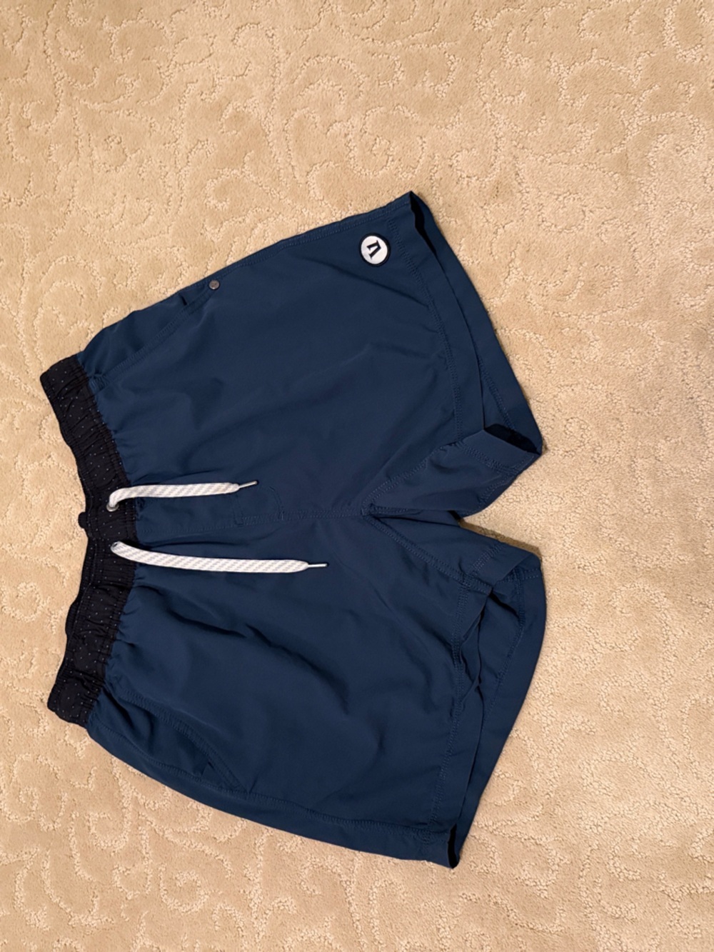 Vuori Navy Athletic Shorts with Black Waistband and White Drawstring